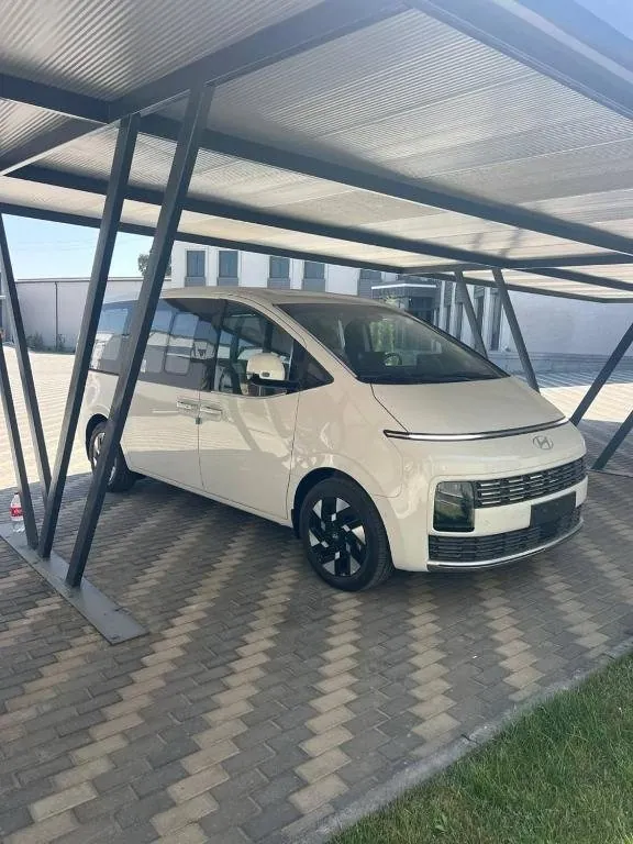 A white Hyundai Staria minivan