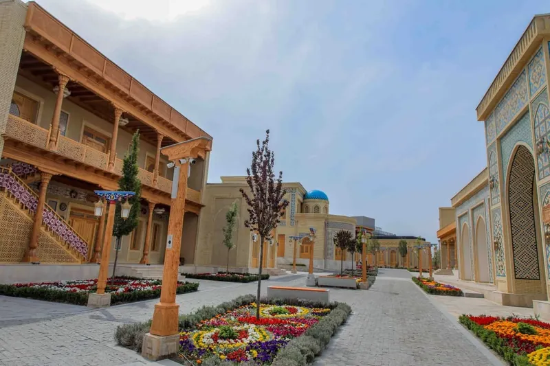 A courtyard with carved wooden balconies in the Fergana Valley