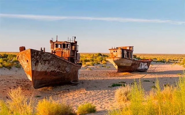 Rusting ships on the dry bed of the Aral Sea in Moynaq