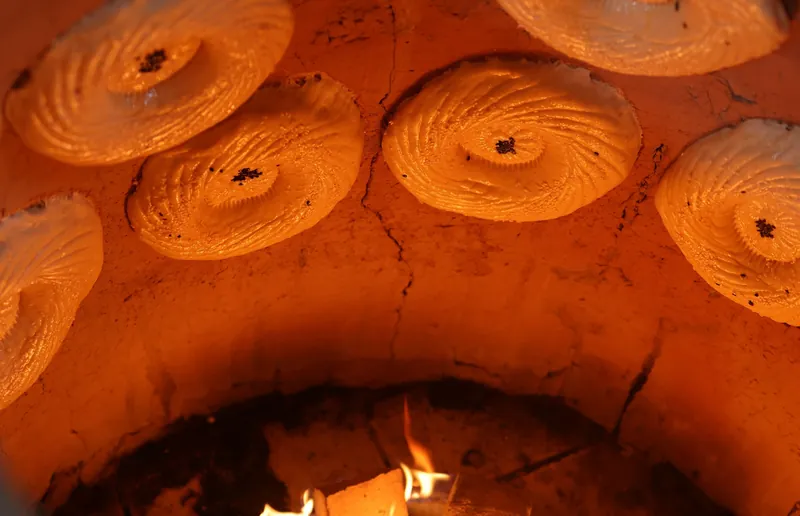 Samarkand bread baking on the walls of a tandoor